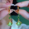 The light luxury and high-end green ginkgo leaf cat's eye stone long tassel earrings are fashionable and elegant, and are popular earrings for women The light luxury and high-end green ginkgo leaf cat's eye stone long tassel earrings are fashionable and elegant, and are popular earrings for women