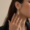 This pair of earrings features a light luxury design for women, with geometric diamond-encrusted cat's eye stone earrings that are versatile and elegant. It is a long and unique French-style ear accessory This pair of earrings features a light luxury design for women, with geometric diamond-encrusted cat's eye stone earrings that are versatile and elegant. It is a long and unique French-style ear accessory