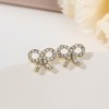 Korean version of light luxury pearl bow stud earrings, a trendy and high-end ear accessory, small and versatile s925 silver needle earrings