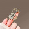 Design sense, individuality, niche musical note guitar brooch, high-end and elegant clothing pin, new suit accessory Design sense, individuality, niche musical note guitar brooch, high-end and elegant clothing pin, new suit accessory