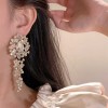 The new light luxury super sparkling crystal tassel stud earrings feature a niche design that is simple, exquisite, fashionable, versatile and high-end