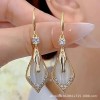 This pair of earrings features a light luxury design for women, with geometric diamond-encrusted cat's eye stone earrings that are versatile and elegant. It is a long and unique French-style ear accessory This pair of earrings features a light luxury design for women, with geometric diamond-encrusted cat's eye stone earrings that are versatile and elegant. It is a long and unique French-style ear accessory